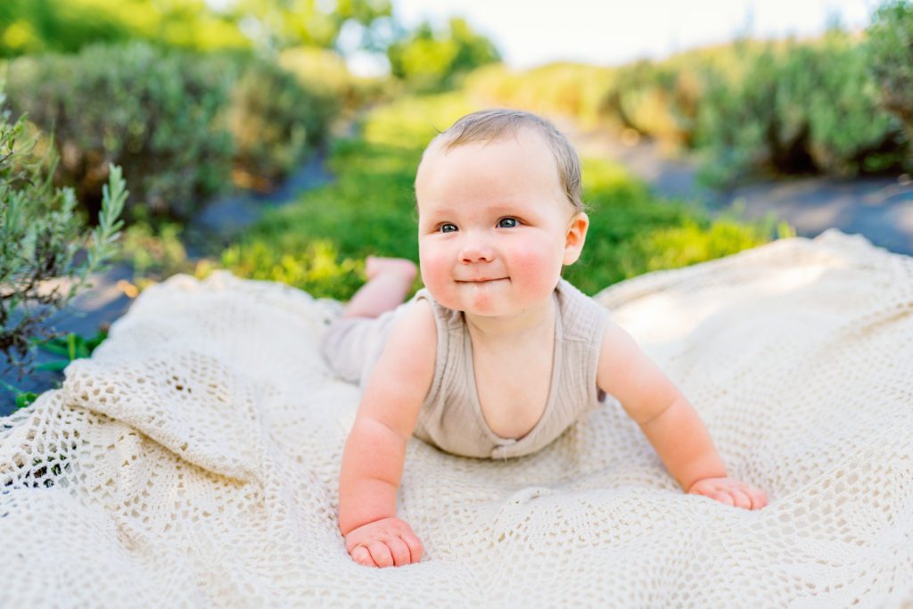 baby smiling at 6 month milestone wildflower family session 