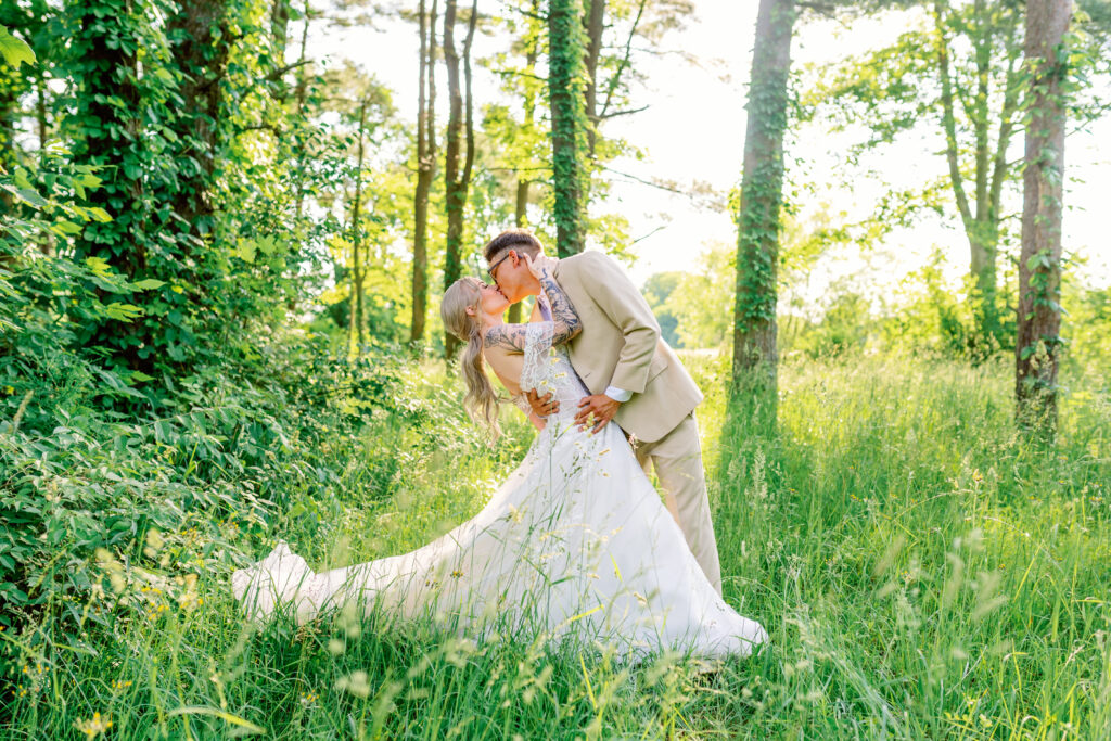 bride and groom portrait in a sunlit forest 