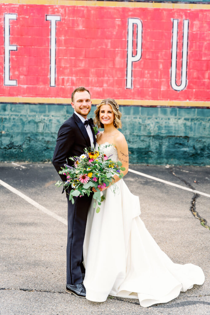 bride and groom infront of 2nd Street Market in Dayton 