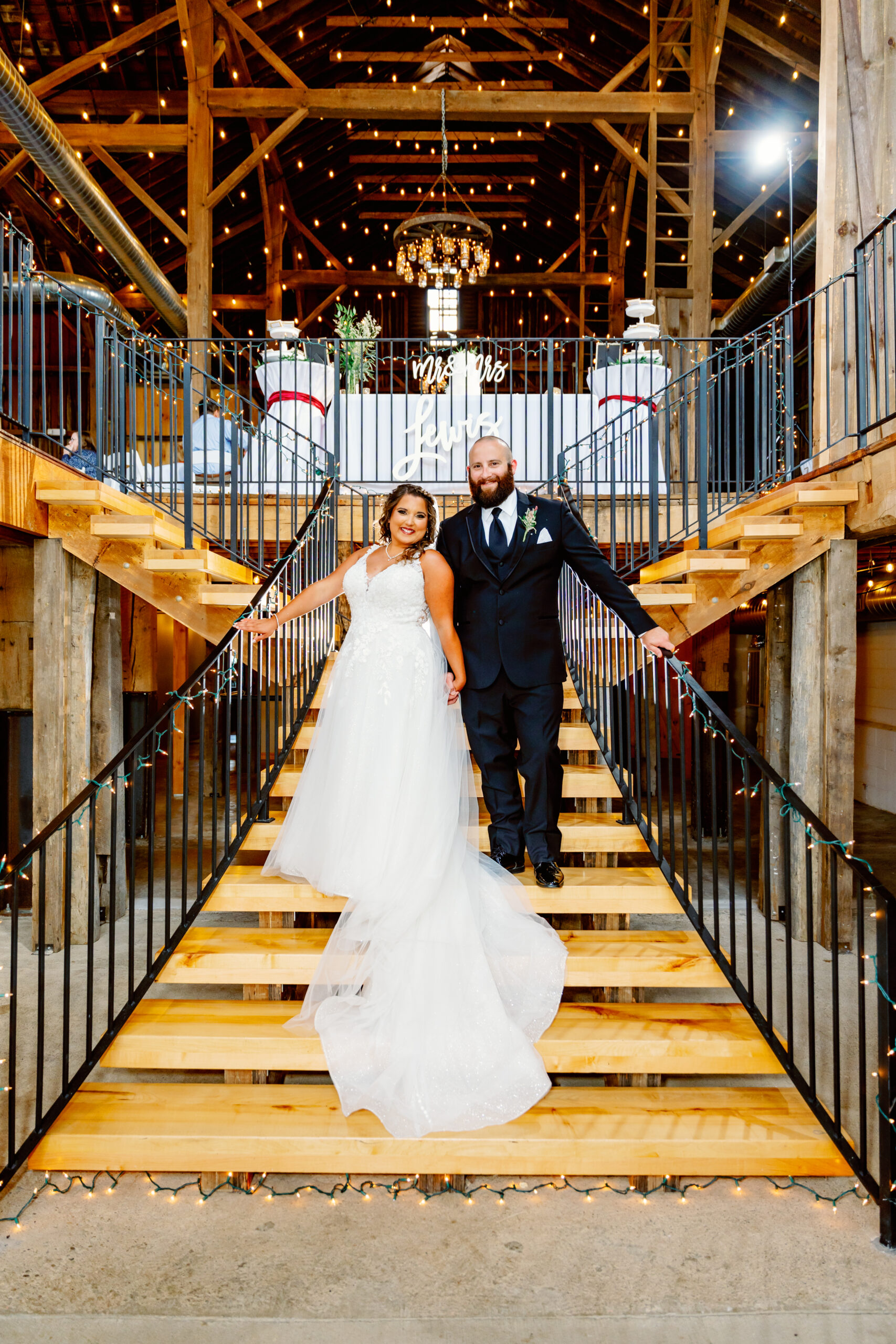 The bride and groom on the staircase.